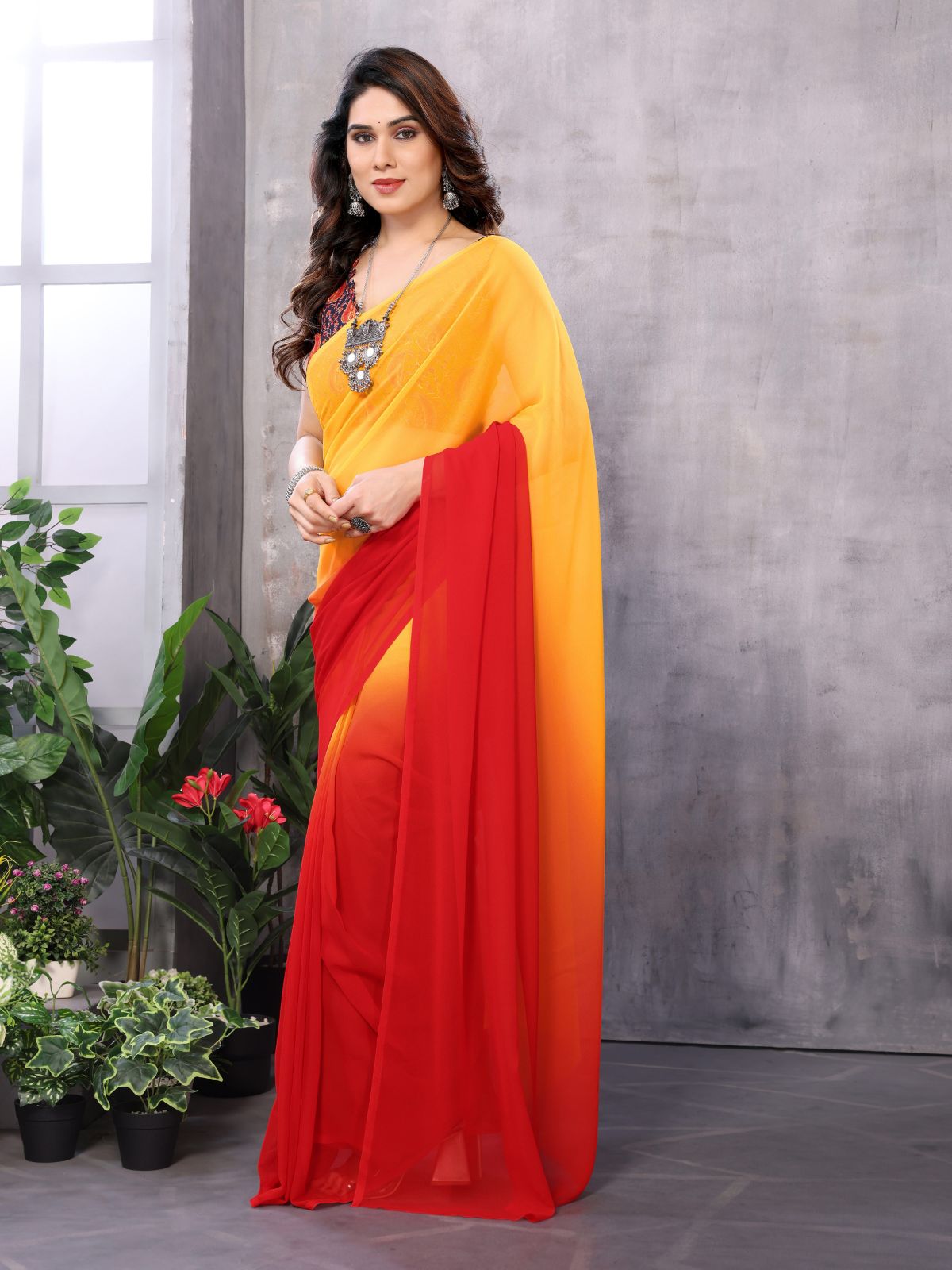 Odette Women Yellow And Red Georgette Solid Saree With Unstitched Blouse