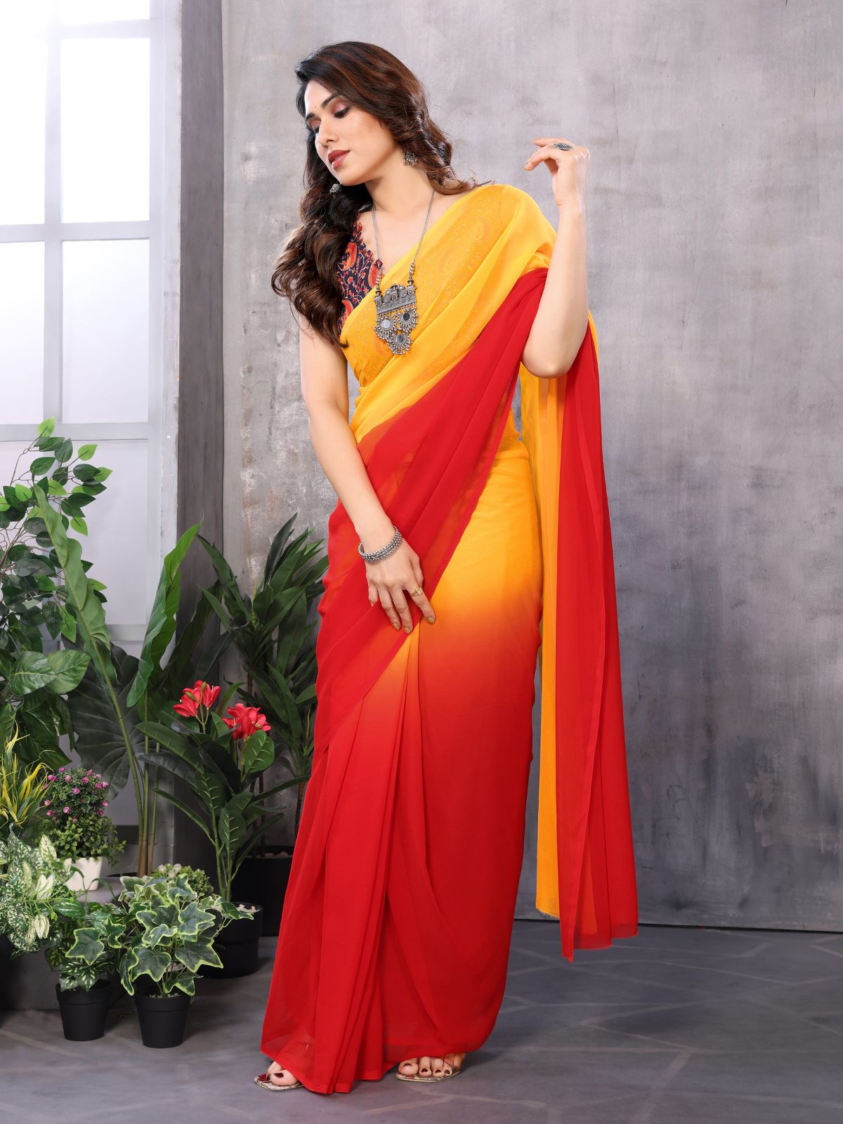 Odette Women Yellow And Red Georgette Solid Saree With Unstitched Blouse