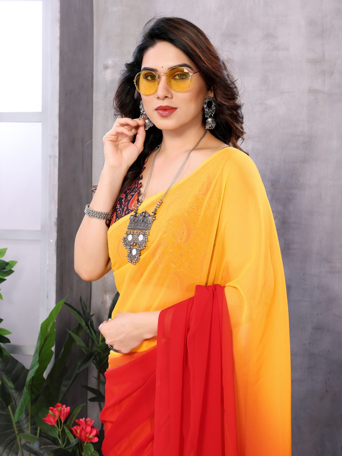 Odette Women Yellow And Red Georgette Solid Saree With Unstitched Blouse