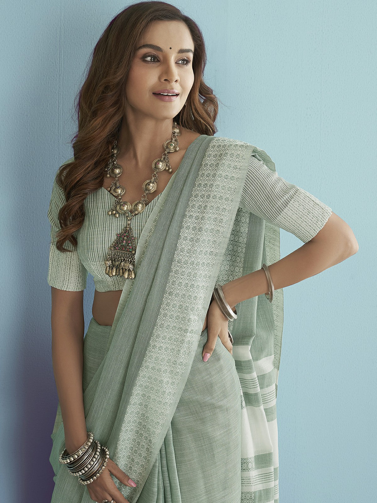 Green Solid Linen Chikankari Weaved Border Saree With Unstitched Blouse.