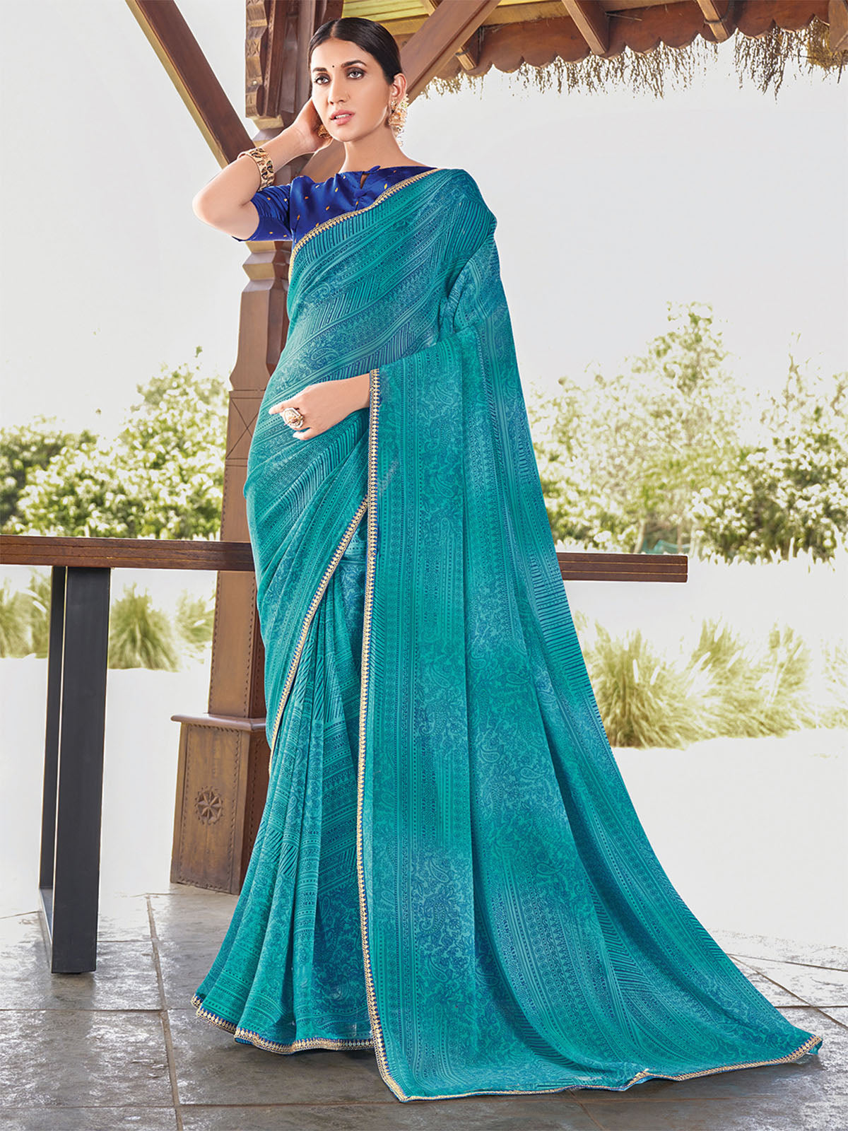 Odette Women Georgette Teal Blue Printed Saree With Unstitched Blouse
