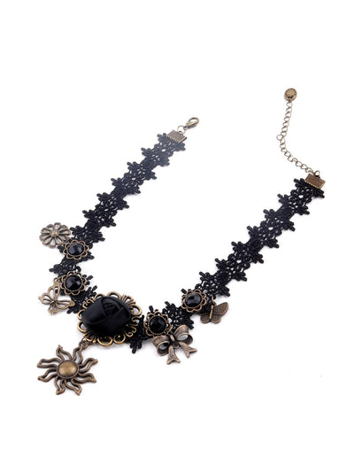Black lace statement necklace embellished with charms - Odette