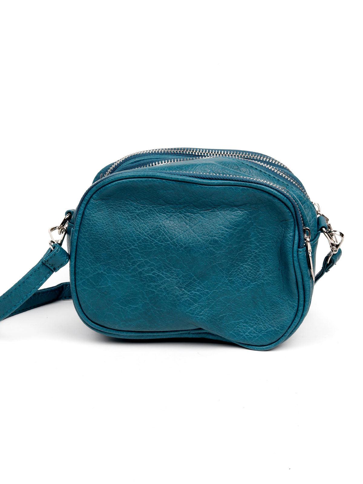 Classic blue textured sling bag for women - Odette