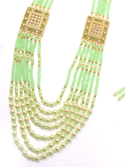Flaunting green beads and pearl necklace - Odette