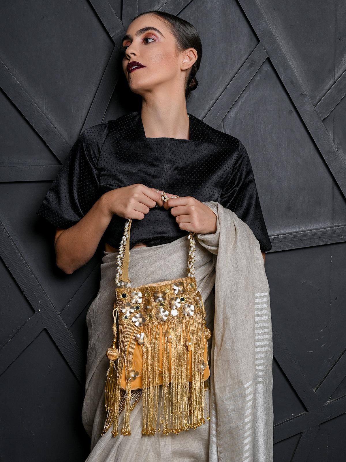 Buy Stunning Gold fringes beaded Potli bag for women Online. – Odette